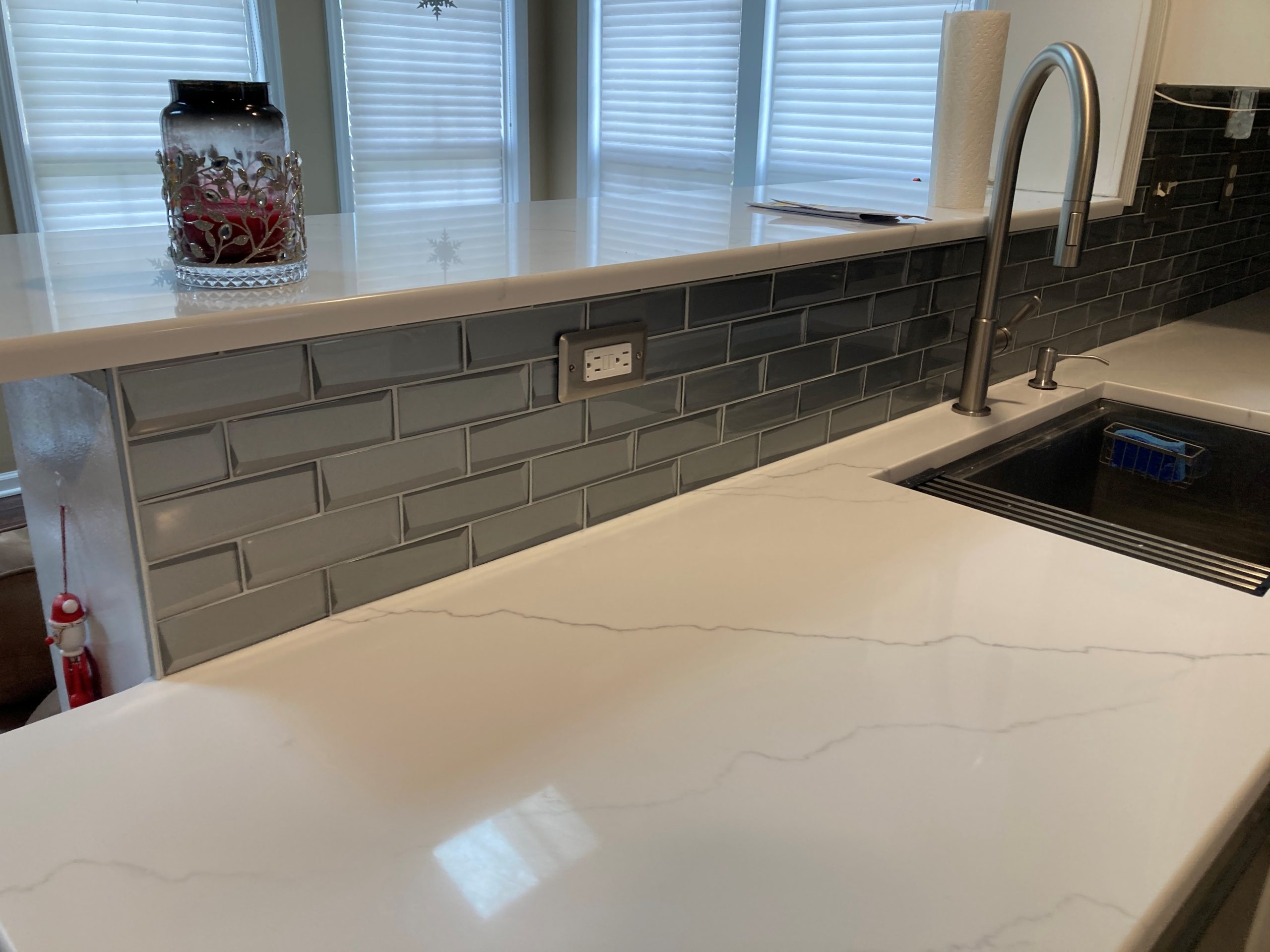 gray tile backsplash and granite countertop for kitchen done by Kulp Tile